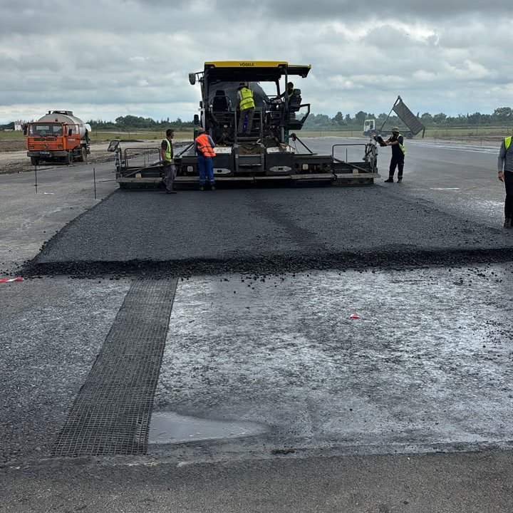 Fresh asphalt mat behind a Vogele paver